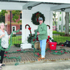 CHRISTMAS DECORATIONS GOING UP - Members of the San Augustine Garden Club have been busy decorating the SA Courthouse Square for the holidays, which they have been doing for many years.  Garden Club President Tammy Barbee and Mike Marshburn are pictured above decorating the Stripling Pavilion on the Northeast corner of the courthouse lawn.                                                                                                   Tribune Photo